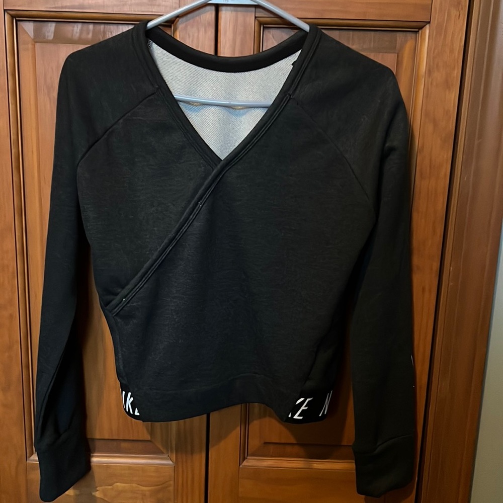 Women’s Dark Grey Nike Dry-fit long sleeve workout top.